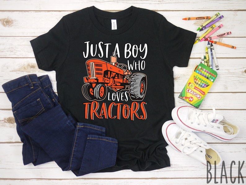 May include: Black t-shirt with a red tractor graphic and the text "Just a boy who loves tractors".