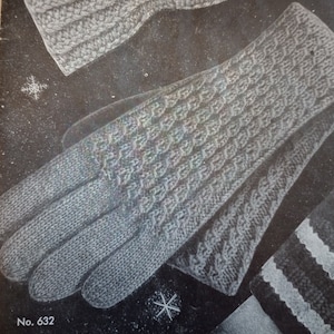 May include: A pair of gray knitted gloves with a textured pattern. The gloves are shown on a black background with a snowflake design. The text "No. 632" is printed on the bottom left corner of the image.