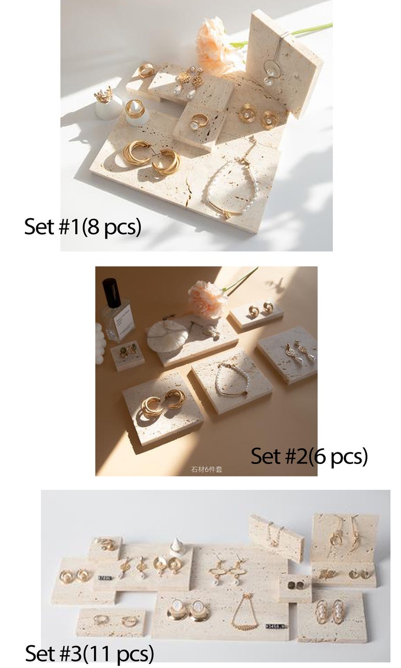 May include: Three sets of small, square, beige, textured display trays with gold jewelry on them. The jewelry includes earrings, necklaces, and rings. The trays are arranged in a grid pattern. The text "Set #1 (8 pcs)", "Set #2 (6 pcs)", and "Set #3 (11 pcs)" is visible below each set of trays.