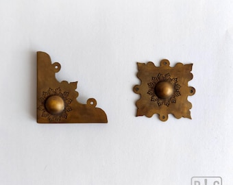 Brass furnishings to bookbinding - 309-312 - [corners and centre pieces] Bookbinding tools