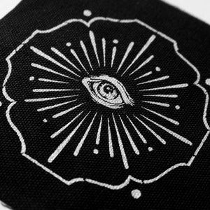 Vision - screen printed patch with silver ink on black canvas