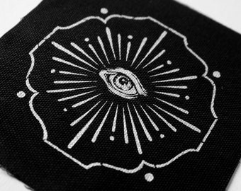 Vision - screen printed patch with silver ink on black canvas