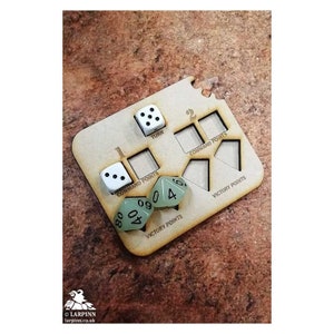 May include: A wooden game tracker with spaces for turn, command points, and victory points.  The tracker has dice in the spaces, including a white die with six dots, a white die with two dots, and three green dice with numbers.
