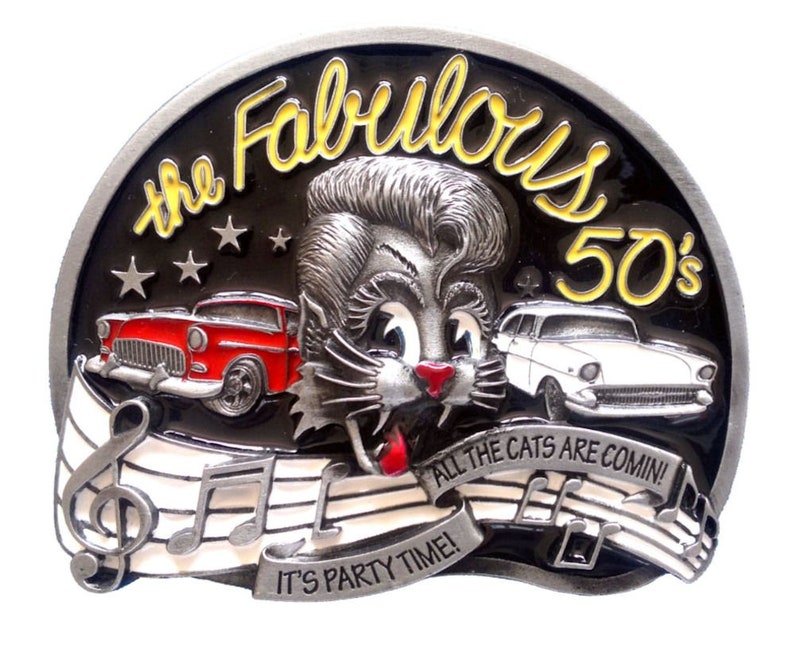 May include: A silver belt buckle with a black background featuring a cartoon cat with a pompadour hairstyle. The buckle says "The Fabulous 50's" and "All the cats are comin' It's party time!" with musical notes.