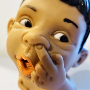 Old expression figurine