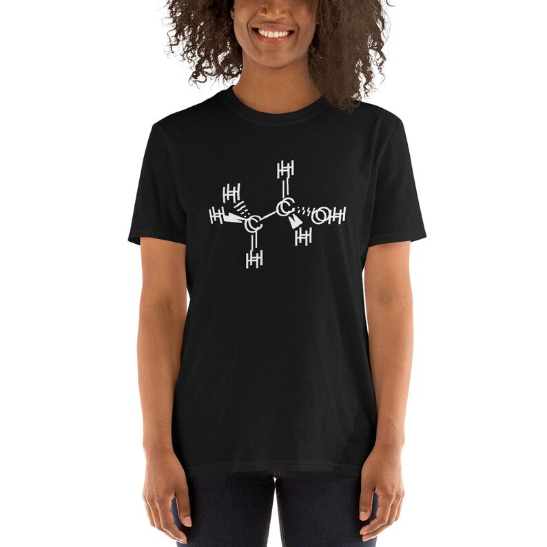 May include: A black t-shirt with a white chemical structure printed on the front. The structure is a representation of a molecule with carbon, hydrogen, and oxygen atoms.