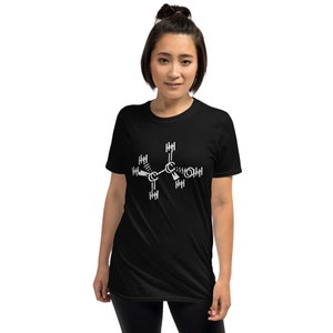 May include: A black t-shirt with a white graphic of a chemical structure. The structure is a molecule with carbon, hydrogen, and oxygen atoms.