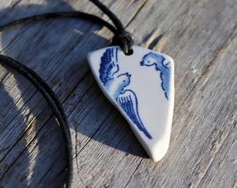 Sea pottery necklace, a beautiful one off blue and white piece depicting "Lovebirds", on a waxed black cord which is adjustable