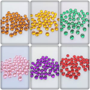 May include: Assortment of small, round, faceted rhinestones in various colours, including orange, yellow, green, pink, purple, and red. The rhinestones are scattered on a white background.