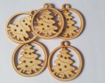 May include: Six unfinished wooden ornaments shaped like Christmas trees. Each ornament has a hole at the top for hanging.