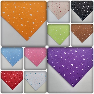 May include: A collection of 10 different coloured faux leather sheets with a white raindrop pattern. The colours are orange, beige, black, green, brown, light blue, pink, purple, red, and light blue.