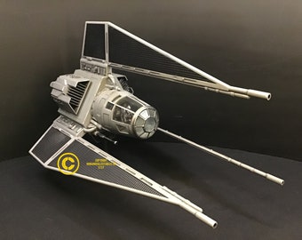 May include: A gray TIE Interceptor model with black wings and a clear cockpit. The model has a detailed design and is a great addition to any Star Wars collection.