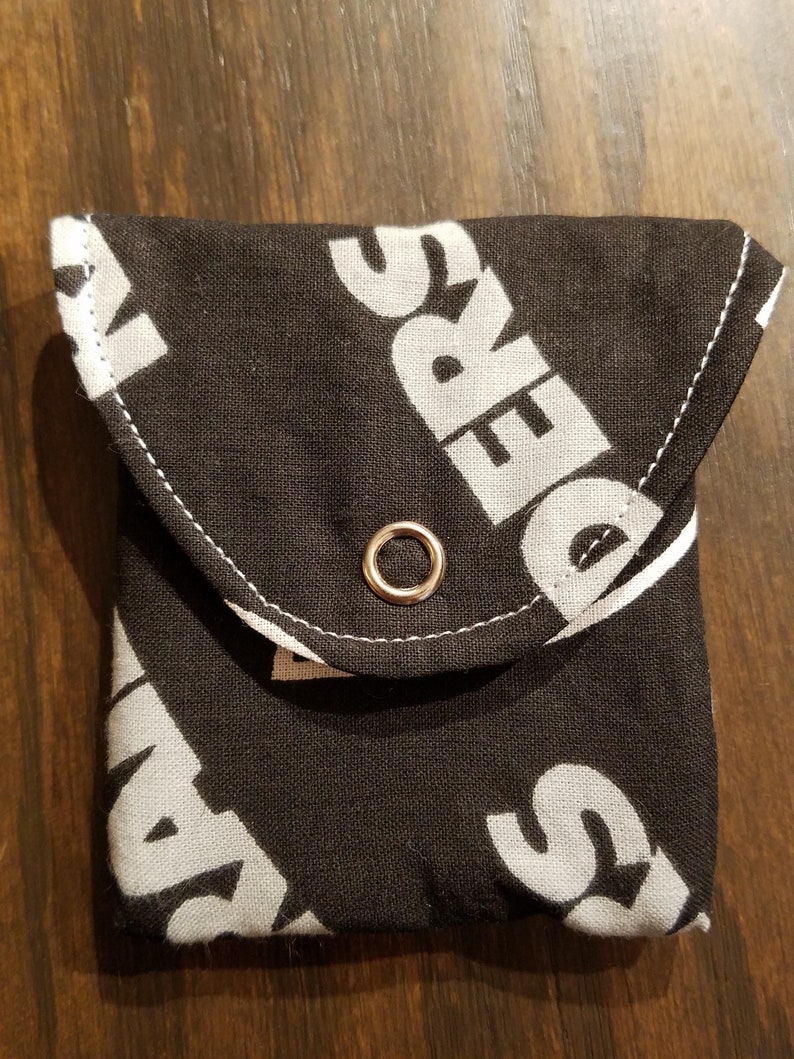 Raiders with a Solid Black Interior Rosary Coin Fabric Purse with Metal Snap Closure