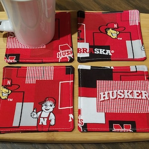 Quilted Fabric Coasters - Nebraska Huskers Block Fabric with Black on Reverse  - Set of 4