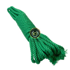 May include: A coiled green rope, approximately 3 metres long, is ready for use. The rope is made of natural fibres and is strong and durable. It is perfect for a variety of uses, including crafts, gardening, and outdoor activities.