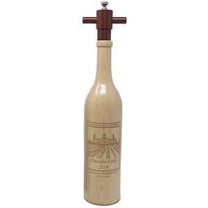 May include: Wooden wine bottle shaped salt and pepper grinder with a red top and a label that reads "Chateau Cook 2018".