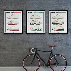 May include: Three framed prints featuring sneaker designs labeled "TUNIS", "ALGER", and "MARRAKESH" in a grid pattern. A black bicycle with red-lined wheels leans against a gray wall, complementing the artwork's color scheme.