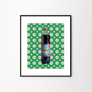 May include: A glass bottle of dark brown soda with a red and blue label that says "Veritable Selecto" on a green and white patterned background.