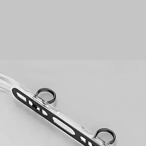 Close-up of double buckle extension mechanism for secure phone strap attachment.