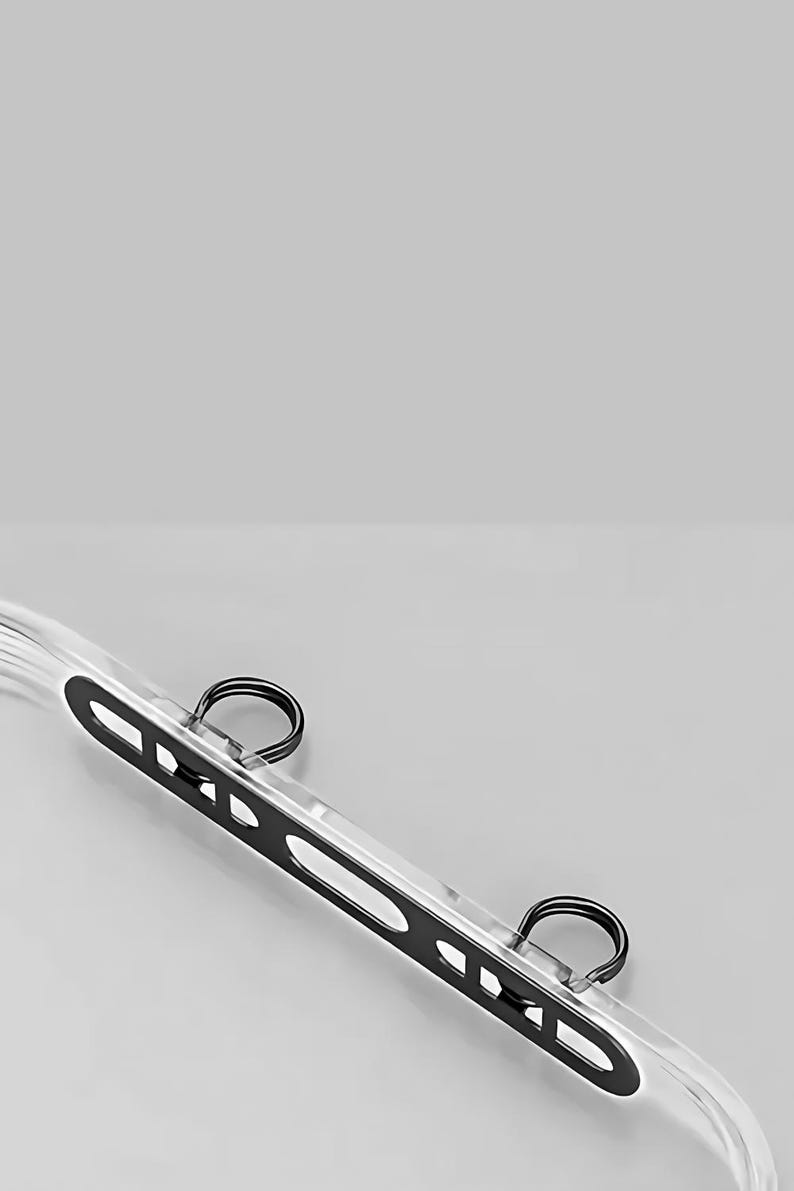 Close-up of double buckle extension mechanism for secure phone strap attachment.