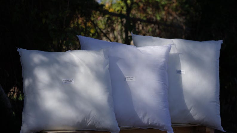 May include: Four white pillow inserts, each with a label that reads "Luxury Foam Pillow Insert".