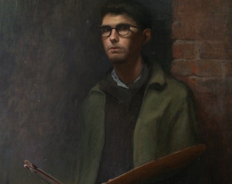 May include: A man wearing glasses and a green jacket holds a wooden artist's palette with paintbrushes. He is standing in front of a brick wall.