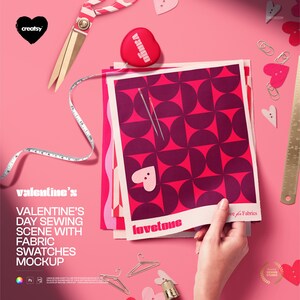May include: A Valentine's Day-themed mockup featuring fabric swatches with a geometric pattern in shades of pink and red. The scene includes sewing tools like scissors, a measuring tape, and a heart-shaped pin cushion. The text "Valentine's Day Sewing Scene with Fabric Swatches Mockup" is visible.