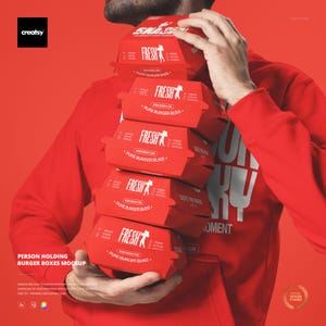 以下が含まれることがあります： 「FRESH」の白い文字が入った赤いハンバーガーボックスの山を人が持っています。「PURE BURGER BLISS」と材料リストも表示されています。背景は赤色です。