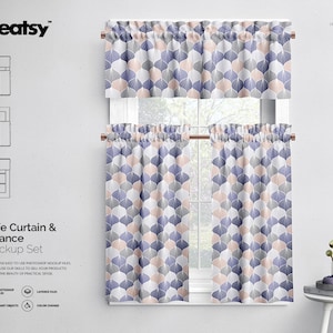 May include: A mockup of a cafe curtain and valance set with a geometric pattern in shades of blue, pink, and white. The curtains are hung on a window with a white frame. The curtains are made of a soft, lightweight fabric.