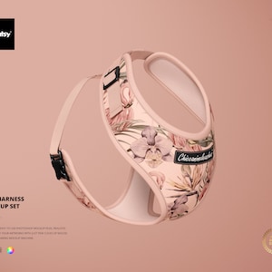 May include: A pink dog harness with a floral pattern featuring pink flamingos, orchids, and palm leaves. The harness has a black buckle and a black label that says "Chiccanimlesslic".