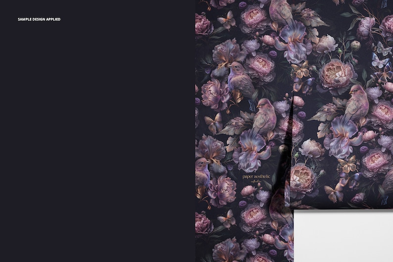 May include: A dark purple floral wallpaper with a repeating pattern of flowers, birds, and butterflies. The wallpaper has a vintage aesthetic and is perfect for adding a touch of elegance to any room.
