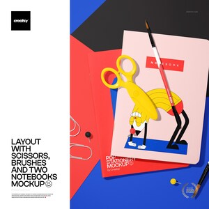 May include: A stationery mockup featuring a pink notebook with the word "NOTEBOOK" in red, a yellow scissor, a red and white paintbrush, and a cartoon illustration. The layout includes a red and blue background with the text "LAYOUT WITH SCISSORS, BRUSHES AND TWO NOTEBOOKS MOCKUP".