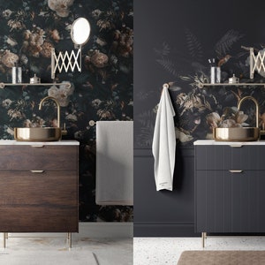 May include: A bathroom vanity with a dark wood cabinet, gold hardware, and a white marble countertop. The vanity has a gold faucet and a round gold sink. The bathroom has a floral wallpaper with a dark green background and a white towel hanging on a hook.