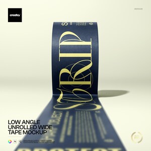 May include: A roll of navy blue tape with gold lettering and design. The tape is unrolled, with the text "PROJECT" visible. The image includes the text "LOW ANGLE UNROLLED WIDE TAPE MOCKUP".