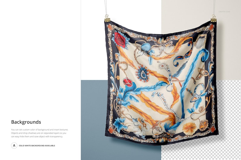 May include: A silk scarf with a colorful floral and chain pattern on a white background. The scarf is black with gold and blue accents. The scarf is hanging from a string.