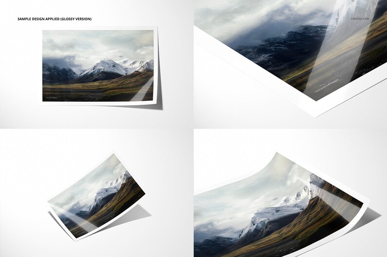 May include: A glossy photo print of a mountain range with snow-capped peaks and a cloudy sky. The photo is printed on a white background and has a slight bend in the bottom right corner.