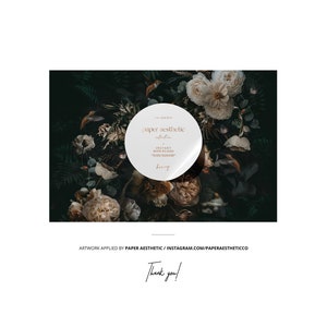 May include: A white circle sticker with the text "paper aesthetic" in a brown font. The sticker is placed on a dark green background with white and brown flowers.