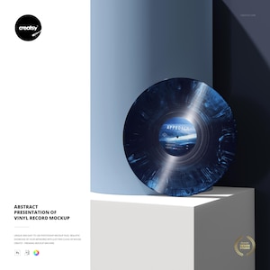 May include: A vinyl record with a blue and black marbled design, titled "Approach." The record is displayed on a white cube against a blue backdrop. The image includes the text "Abstract Presentation of Vinyl Record Mockup."