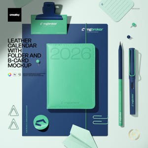 May include: A mint green 2026 leather calendar, a dark blue folder, a business card with a dark blue clip, a two-toned pencil, a dark blue fountain pen, two paper clips, a circular logo sticker, and a folded paper shape on a light background.