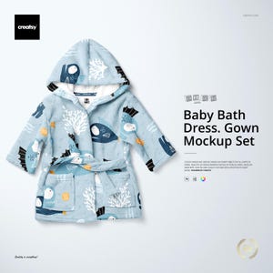 May include: A light blue baby bath robe with a hood, featuring a repeating pattern of cartoon fish and coral. The robe has a matching belt and pockets. The text "Baby Bath Dress. Gown Mockup Set" is visible.
