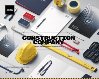May include: A mockup set for a construction company. The set includes a yellow hard hat, a spirit level, a tape measure, a notepad, business cards, and a lanyard. The text "Building with Vision" is on the notepad and business cards. The text "Construction Company" is in large bold letters.