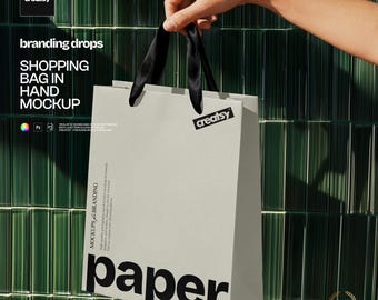 Shopping Bag in Hand PSD Mockup with Editable Paper and Ribbon Handles