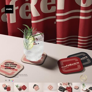May include: A cocktail in a ribbed glass rests on a coaster. The coaster is part of a set with a retro design, featuring the text "Café Retro". The coasters are red, black, and beige.