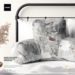 May include: A reading pillow set with a floral and bird design. The pillow has a light green background with white flowers and detailed illustrations of birds. The set includes a velvet and polyester pillow, ideal for reading in bed.
