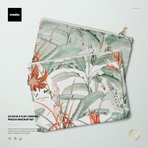 May include: Two flat canvas pouches with a tropical floral design. The pouches feature a botanical print with green leaves, orange flowers, and white blossoms. The pouches have gold zippers and the text "22.5x16.5 FLAT CANVAS POUCH MOCKUP SET".