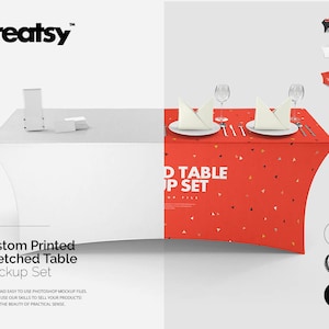 May include: Mockup of a white stretched table cloth with a red tablecloth featuring a white triangle pattern. The table is set with two place settings, each with a white napkin, a glass, and cutlery. The text "D TABLE UP SET" is printed on the red tablecloth.