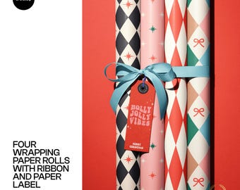Four Wrapping Paper Rolls with Ribbon and Paper Label Mockup