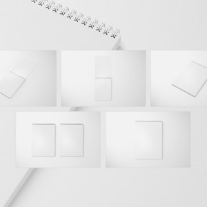 May include: Five different views of a white spiral bound notebook mockup. The notebook is on a white background.
