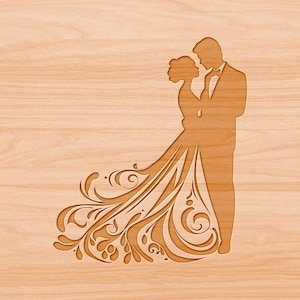 May include: A wood carving of a bride and groom in silhouette. The bride's dress is detailed with intricate floral patterns.
