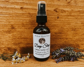 May include: A 2 ounce bottle of Deep Sleep calming herbal spray, handmade in Gore, VT. The bottle has a white label with a full moon graphic and the text "Willow Moon Farm".